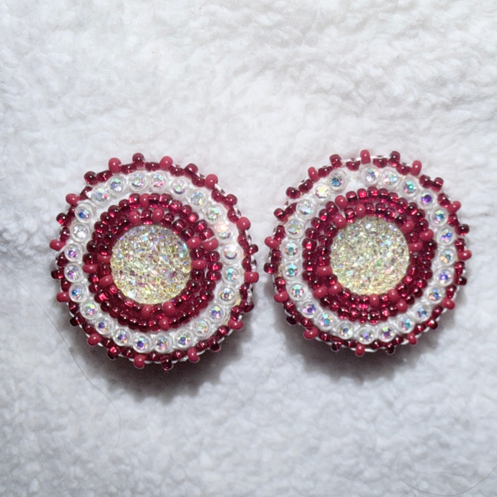 Indigenous beaded earrings on tanned moose hide